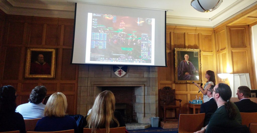Photo of Alex Schladebeck demonstrating how team members work together in World of Warcraft